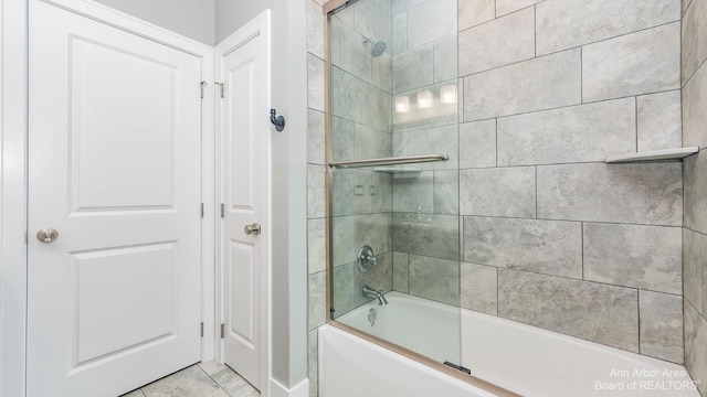 bathroom with enclosed tub / shower combo and tile patterned floors