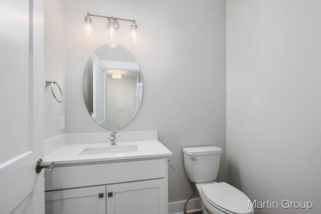 bathroom with oversized vanity and toilet