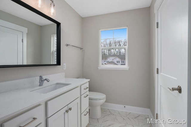 bathroom featuring tile floors, toilet, and vanity