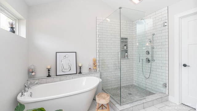 bathroom with shower with separate bathtub