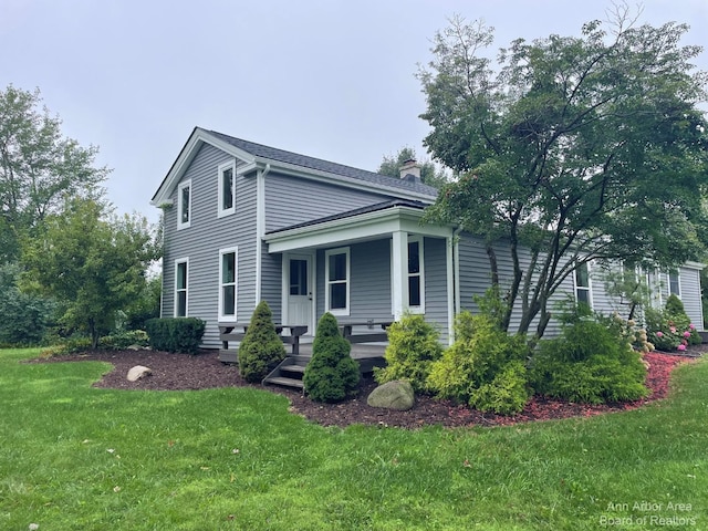 view of front of home with a front lawn and a porch