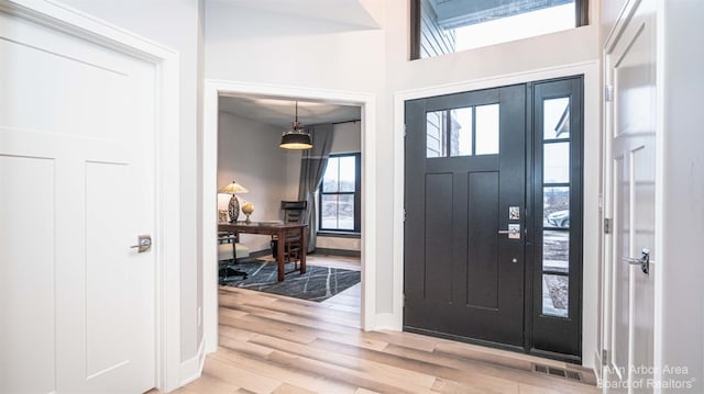 entryway with light hardwood / wood-style flooring