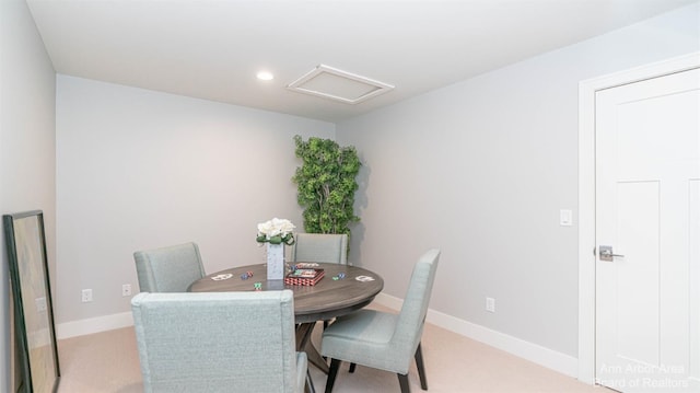 dining area featuring light colored carpet