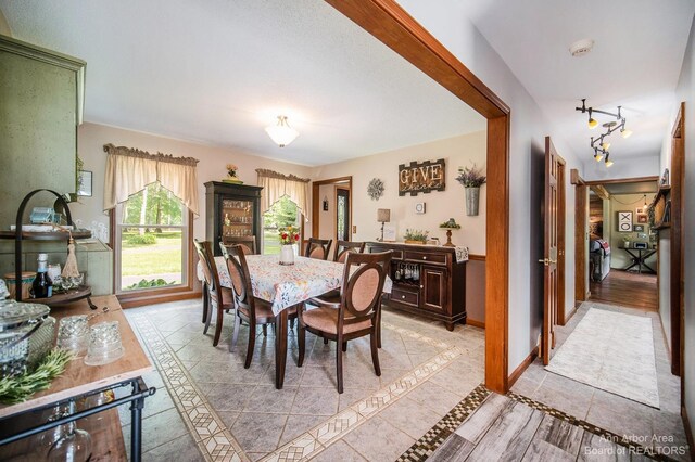 dining space with light tile patterned floors