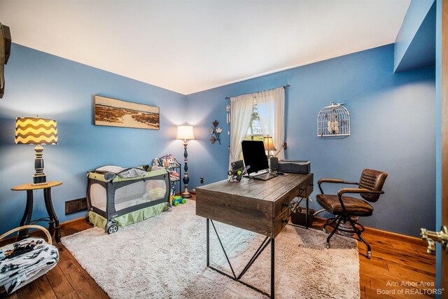 office area with hardwood / wood-style flooring