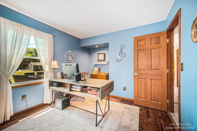 office space with dark hardwood / wood-style floors