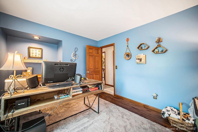 home office with hardwood / wood-style flooring