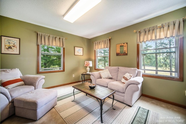 living room with light carpet and a textured ceiling