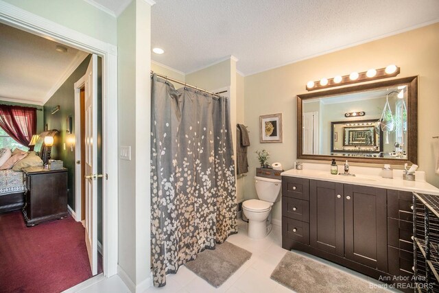 bathroom featuring a textured ceiling, tile patterned floors, vanity, toilet, and crown molding