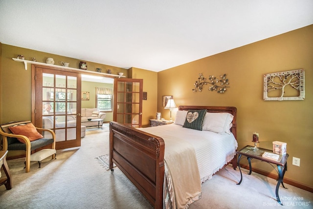 carpeted bedroom with french doors