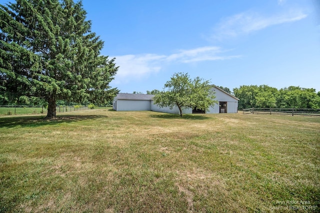 view of yard with a rural view