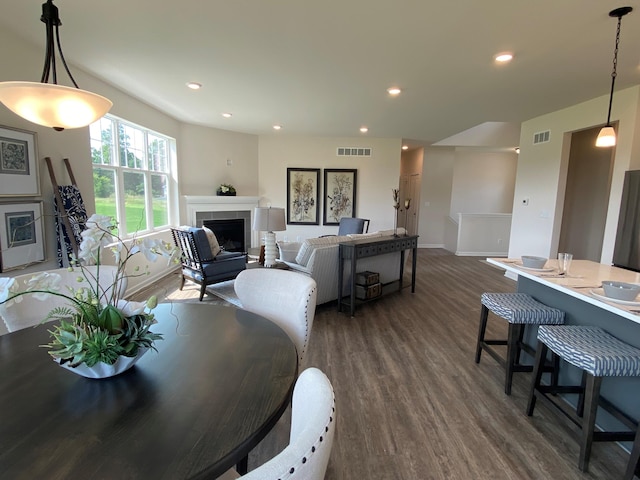 dining space with dark wood-type flooring