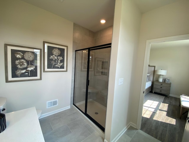 bathroom featuring tile patterned flooring and a shower with door