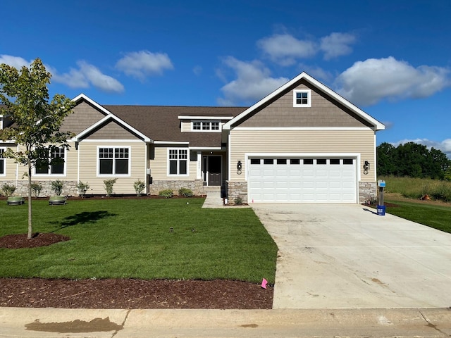 craftsman-style home featuring a garage and a front lawn