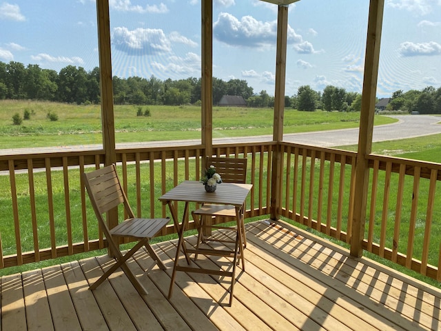 wooden deck with a yard