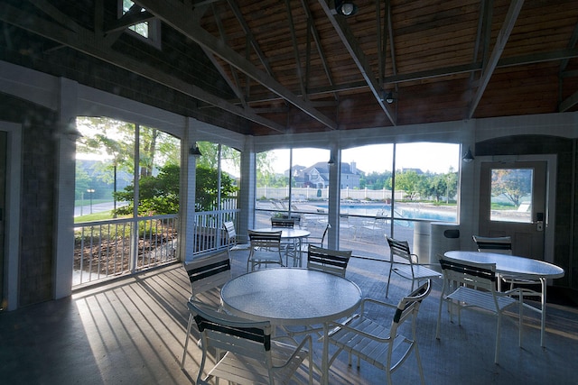 sunroom featuring lofted ceiling