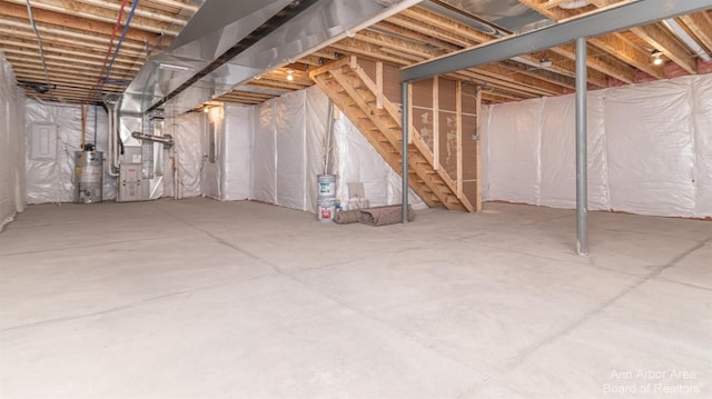 basement with gas water heater and heating unit