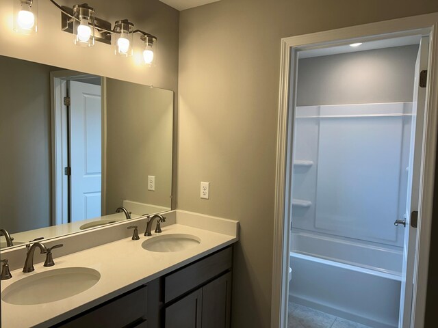 bathroom with tile patterned floors, vanity, and bathtub / shower combination