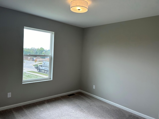 unfurnished room with carpet floors