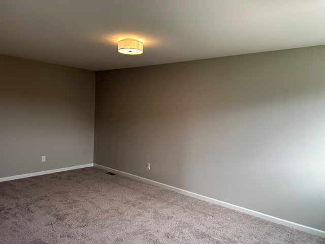 empty room featuring carpet flooring