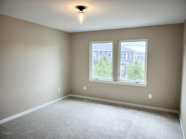 spare room featuring carpet floors