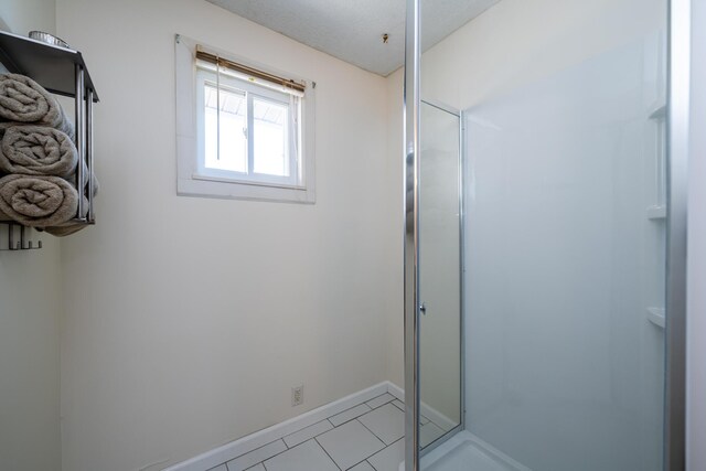 bathroom with tile patterned floors