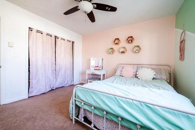 bedroom featuring ceiling fan and carpet floors