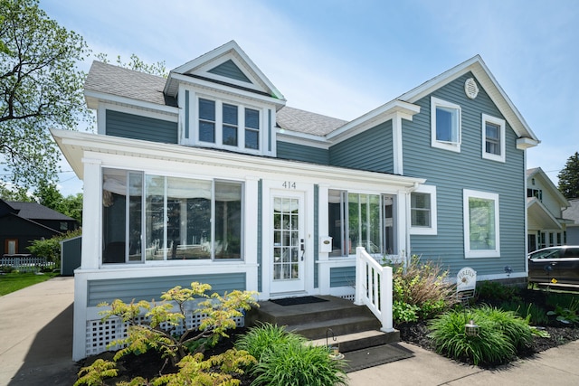 view of front of property with a shingled roof