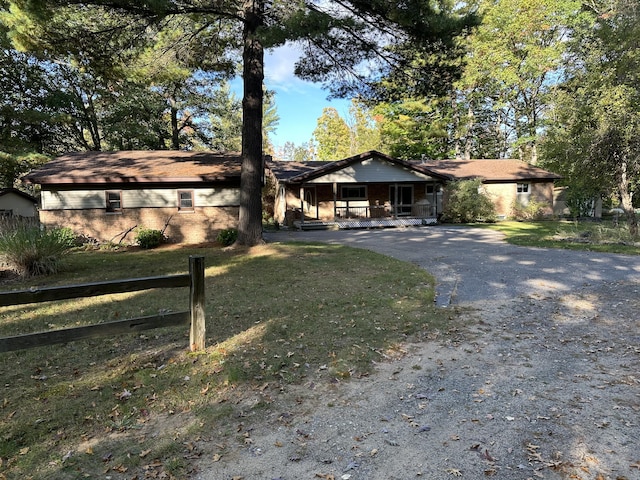 view of front of property with a front yard and covered porch