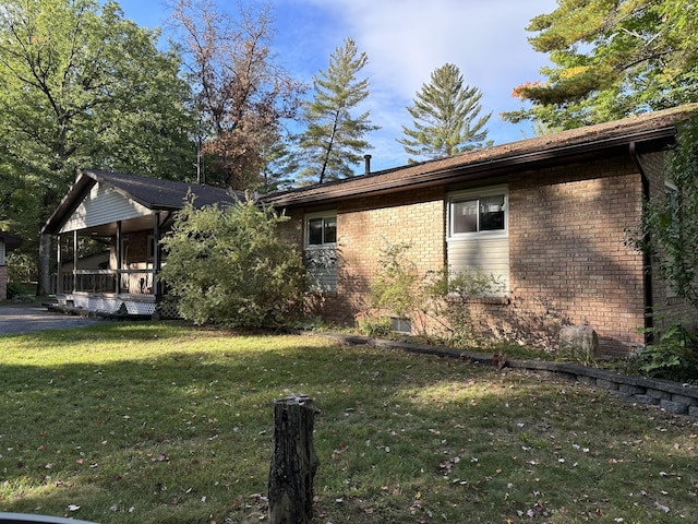 view of property exterior with a yard