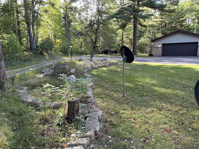 view of yard with a garage