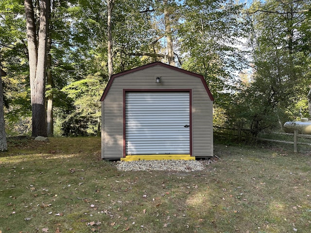 view of outdoor structure featuring a lawn