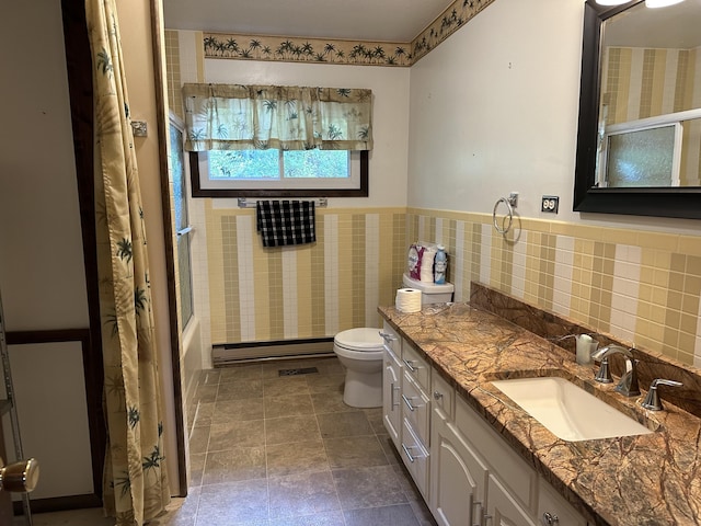 full bathroom featuring vanity, a baseboard heating unit, shower / tub combo, and toilet