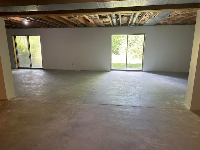 unfurnished room featuring concrete floors