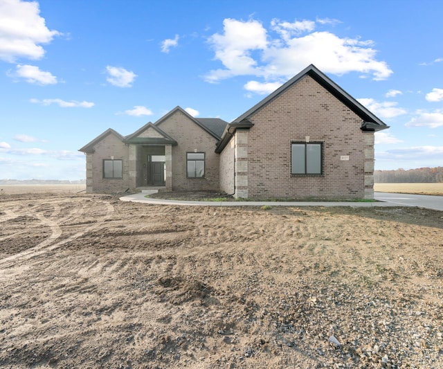 view of front of home featuring brick siding