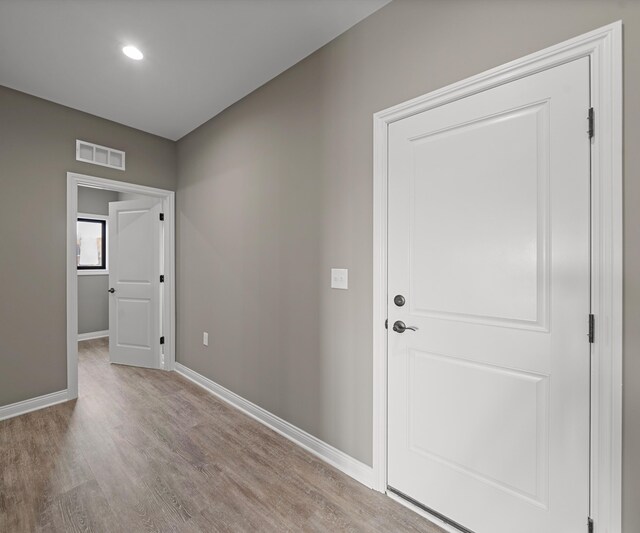 foyer with light hardwood / wood-style floors