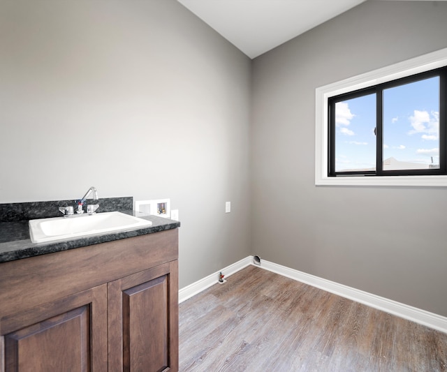 bathroom featuring vanity and wood-type flooring