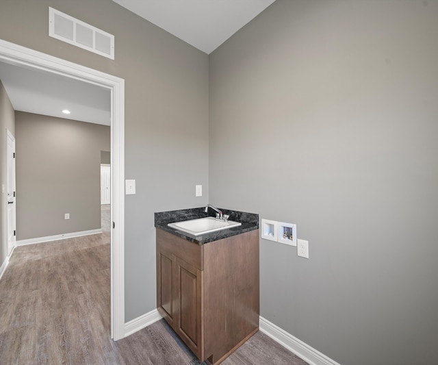 bathroom with wood-type flooring and vanity