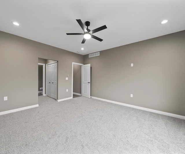 unfurnished room with ceiling fan, recessed lighting, visible vents, and baseboards