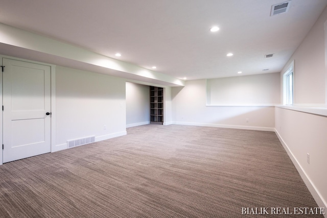 spare room featuring carpet flooring