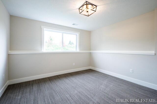 unfurnished room featuring carpet floors