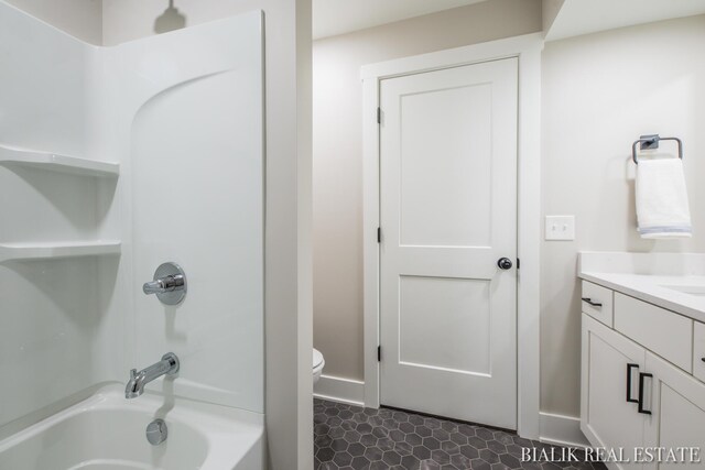 full bathroom with toilet, shower / tub combination, tile patterned flooring, and vanity