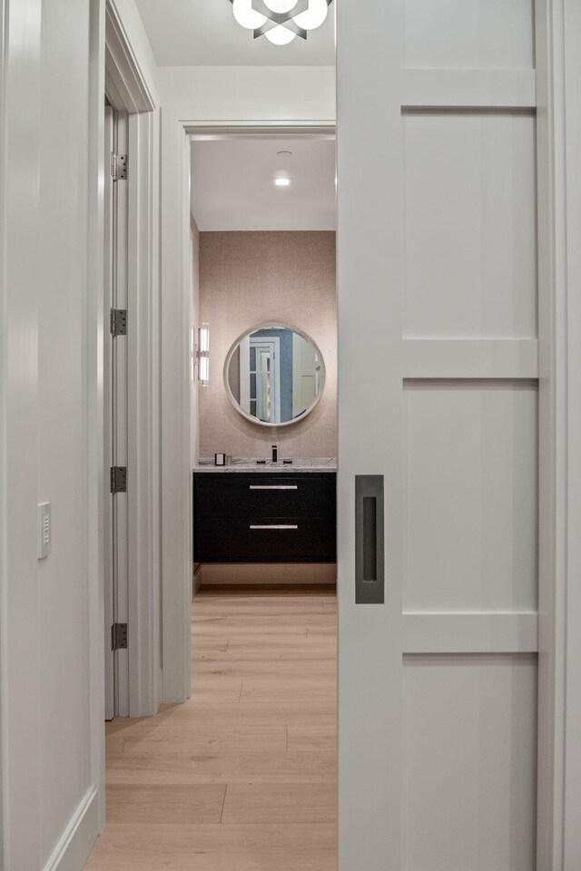 corridor featuring light hardwood / wood-style floors