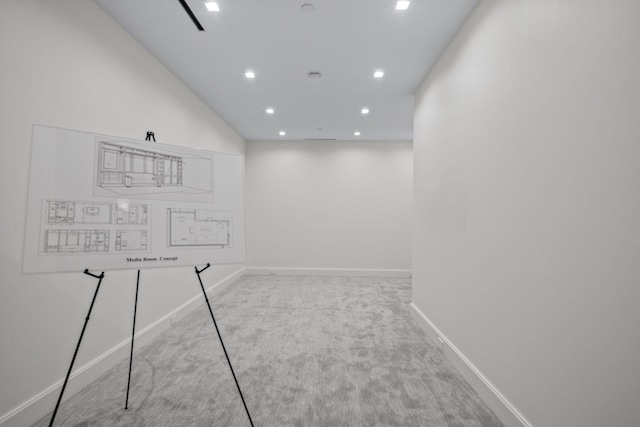 carpeted spare room featuring recessed lighting and baseboards