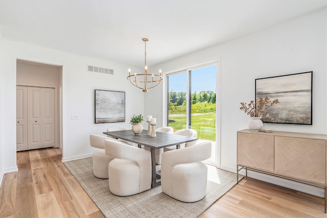 dining space featuring a chandelier and hardwood / wood-style floors