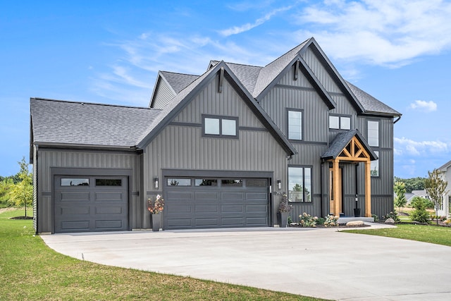 modern farmhouse featuring a front yard and a garage