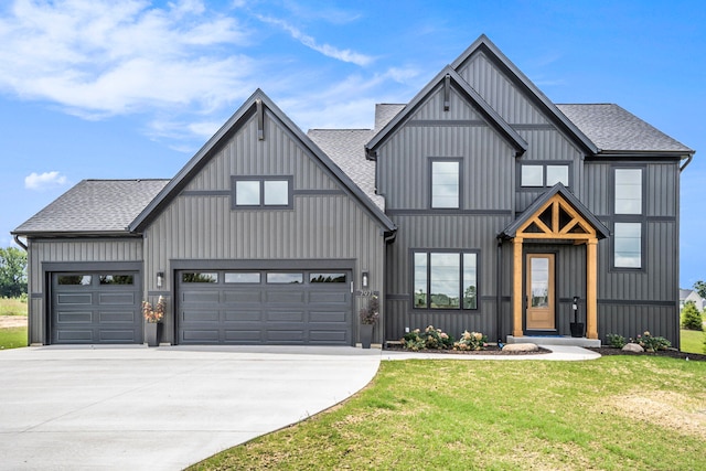 modern inspired farmhouse with a front lawn