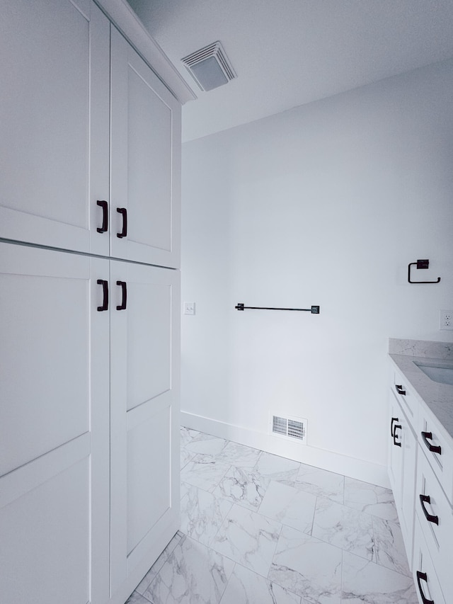 bathroom featuring tile patterned floors and vanity