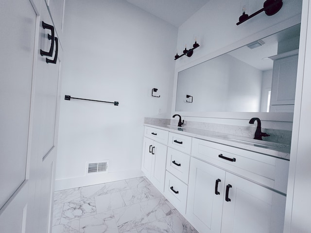 bathroom featuring tile patterned floors and vanity