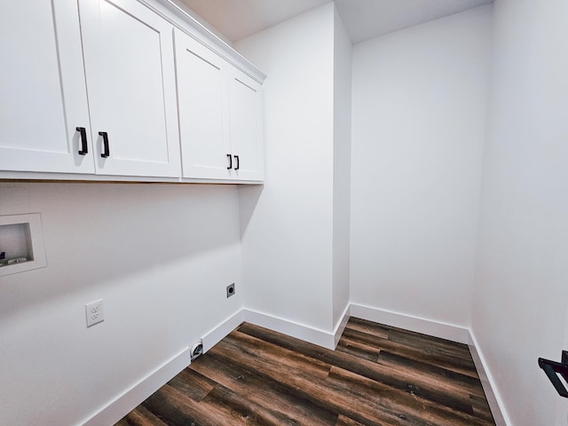 clothes washing area with cabinets, washer hookup, hookup for an electric dryer, and dark hardwood / wood-style floors